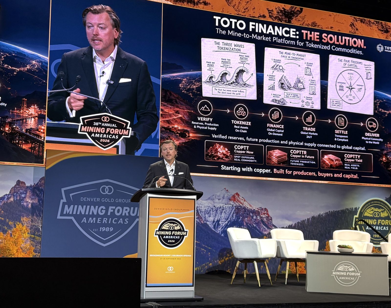 Monty Metzger at the podium with the slide Toto Finance: The Solution, the mine-to-market platform for tokenized commodities