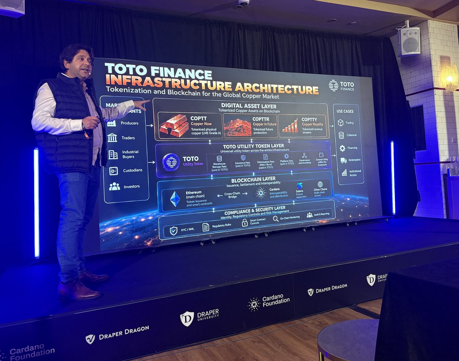 Steven Gaertner presenting the Toto Finance infrastructure architecture slide at the Draper UTXO Pitch Night during TOKEN2049 Singapore