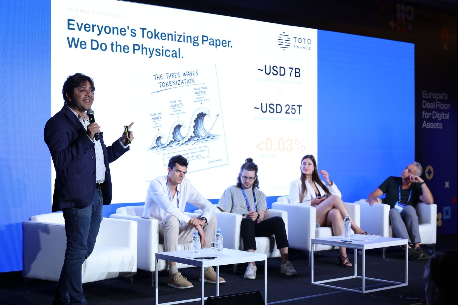 Steven Gaertner on stage at EBC 2026 with the slide Everyone's Tokenizing Paper. We Do the Physical.